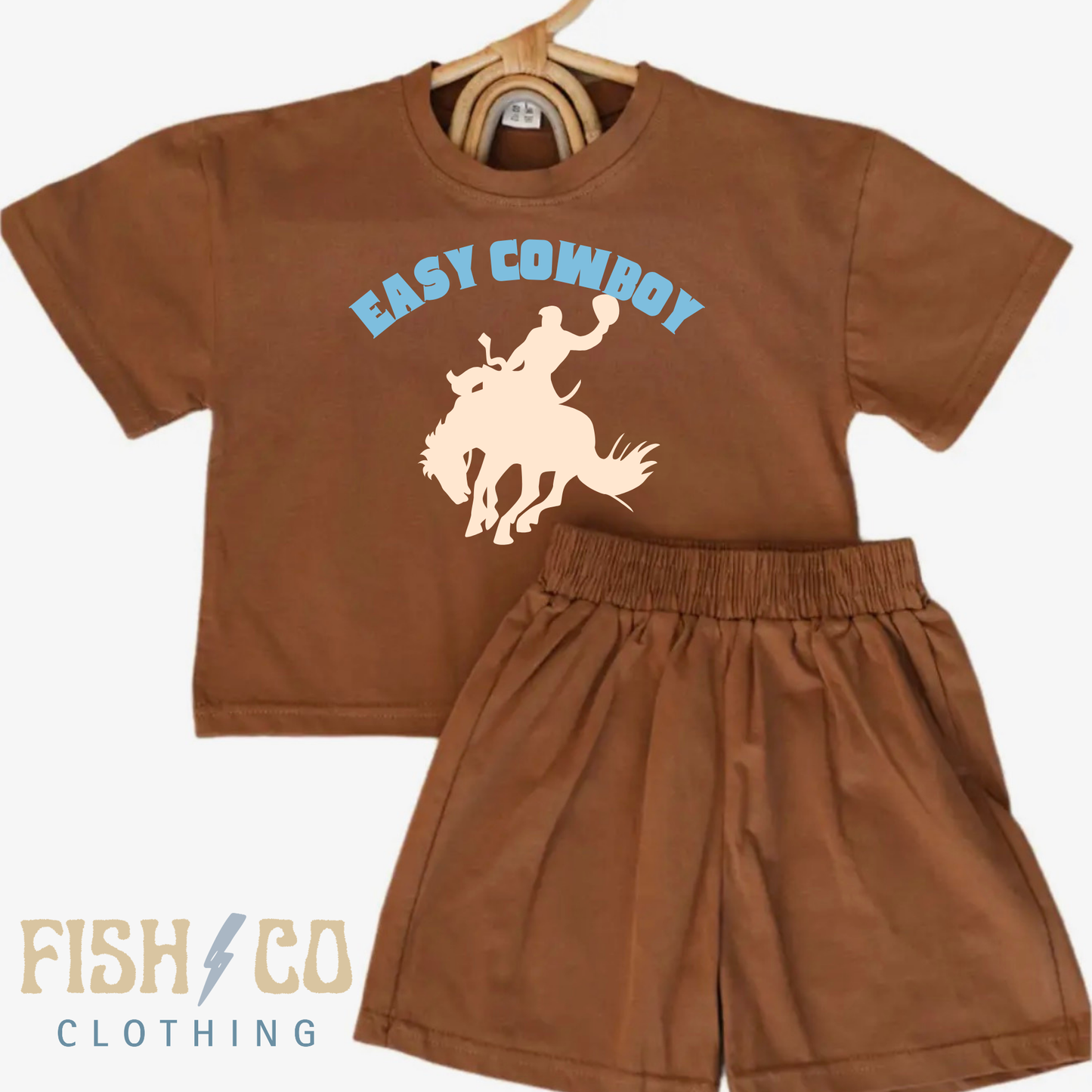 Brown children's t-shirt and shorts set with 'Easy Cowboy' graphic and 'Fish & Co Clothing' branding.